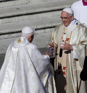 Pope Francis greets Pope Emeritus Benedict XVI. In a surprise move Pope Francis has declared a Holy Year of Mercy beginning December 08th 2015 (Feast of the Immaculate Conception)